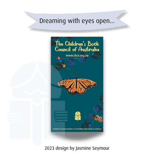 A picture of a small butterfly brooch. Text on a graphic flag reads "Dreaming with eyes open...". Text at the base of the image says "2022 design by Jasmine Seymour."