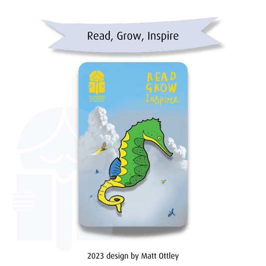 A picture of a brooch in the shape of a seahorse. Text on a graphic flag reads "Read, grow, inspire". Text at the base of  the image says "2023 design by Matt Ottley".