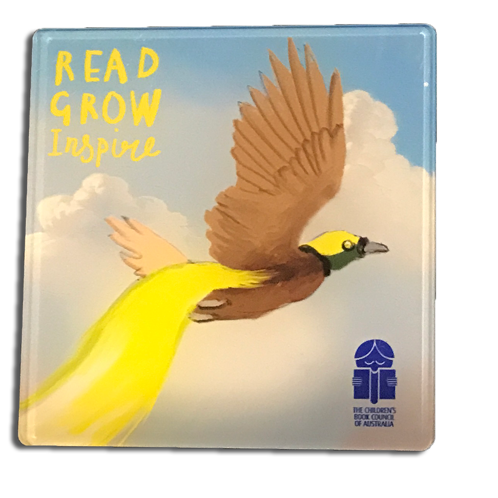 a cup coaster with the image of a yellow tailed paradise bird flying in a cloud filled sky